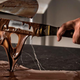 A chef tempering chocolate. (You don’t need any special tools to do it at home.)